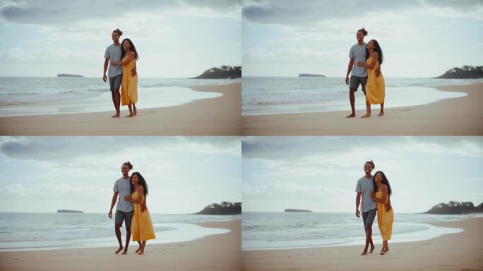 海滩上快乐的年轻黑人夫妇
