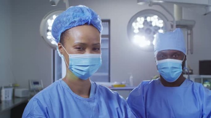 站在手术室中戴着口罩的男女外科医生的肖像