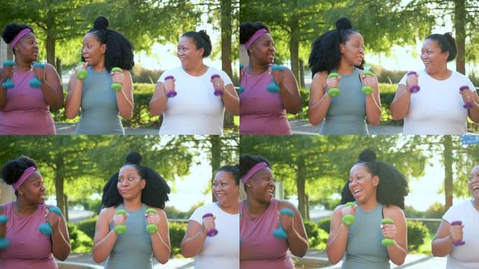 三名多种族妇女在城市公园锻炼，说话