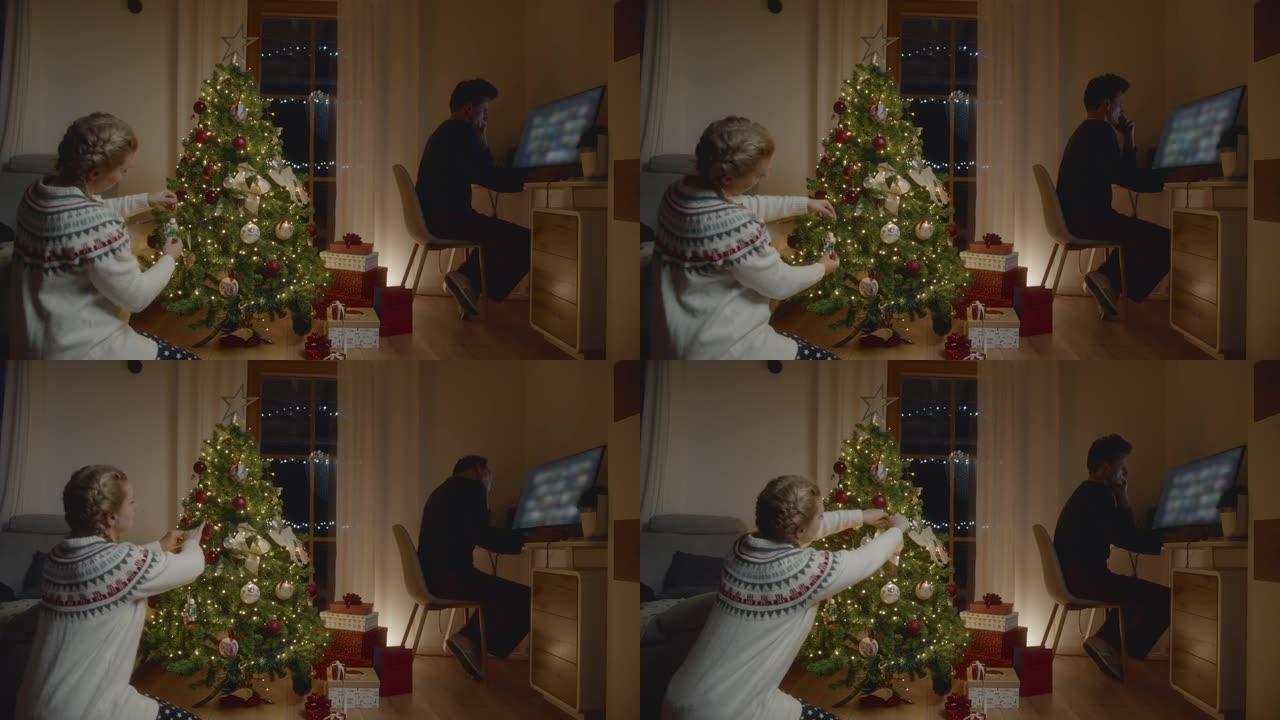 男人在家工作时，女人装饰圣诞树