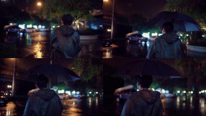 年轻人在下雨的时候穿雨衣。在伞下。外面很黑，正在下雨