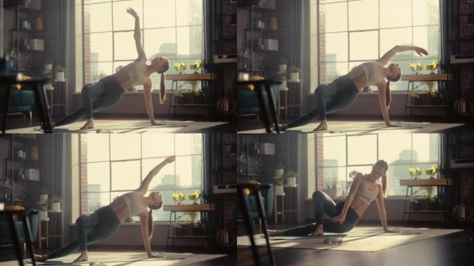 年轻漂亮的女性早上在她阳光明媚的阁楼公寓锻炼、伸展和练习瑜伽。健康的生活方式、健身、幸福和正念概念。