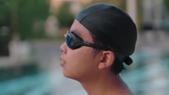 亚洲男子在假期练习游泳