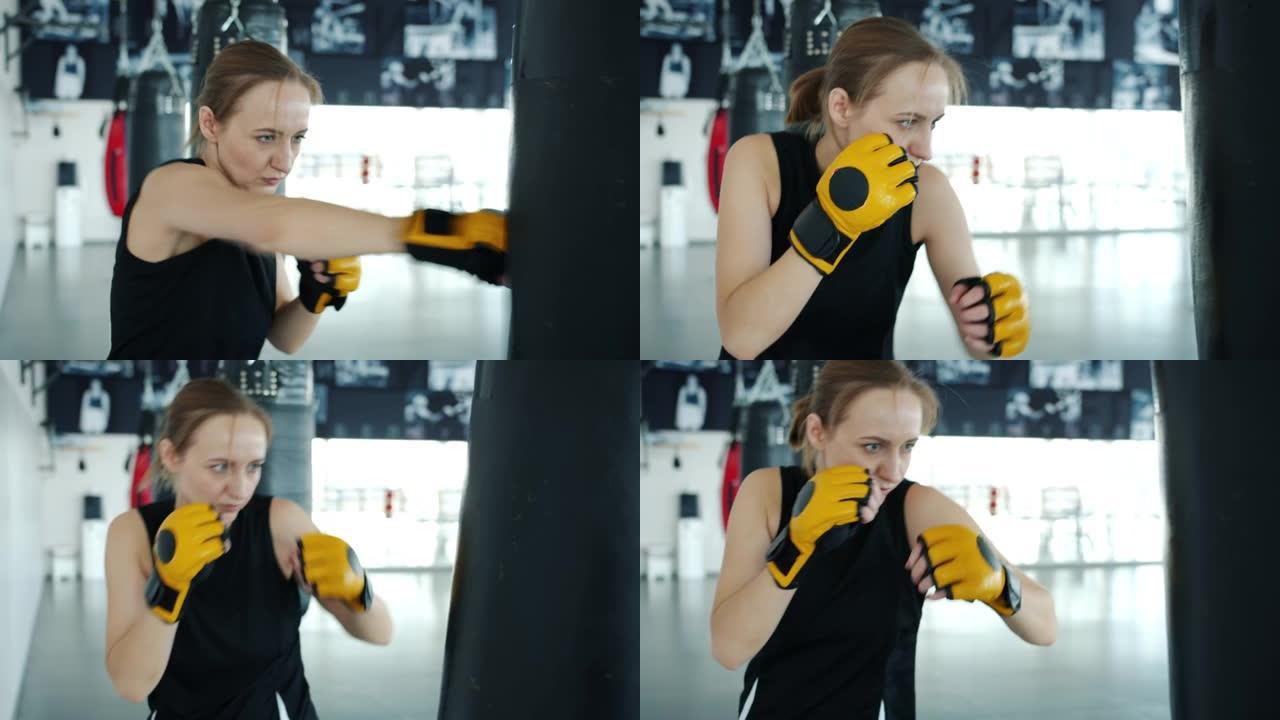 有动力的女运动员在现代健身房室内训练打气筒