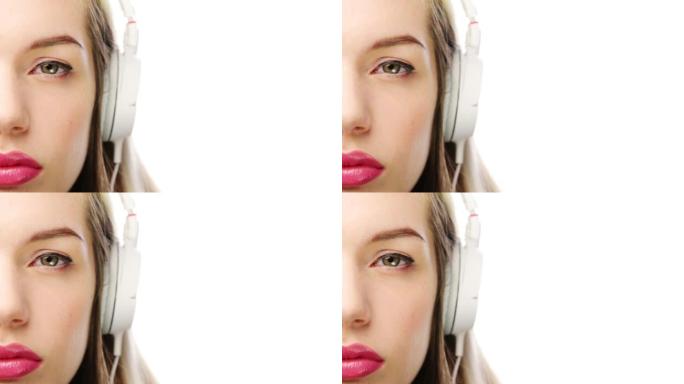一名年轻女子在白色演播室背景下使用耳机的4k视频片段