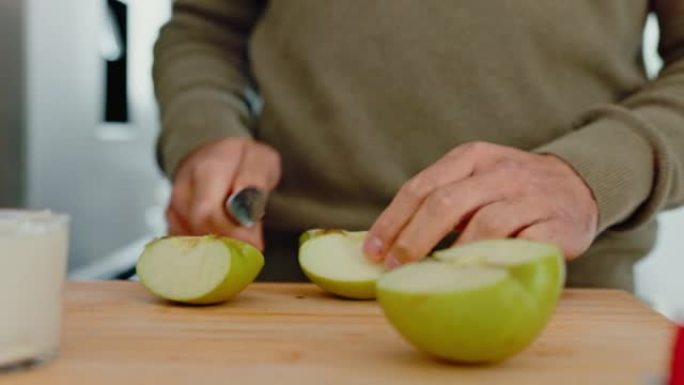 苹果，手和一个男人的手在家里的厨房里切水果，以保持健康，饮食和营养。营养师和健康沙拉，家里有男性切碎