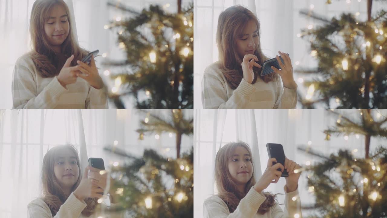 年轻女子正在拍照和录像，称她与男友的圣诞树。