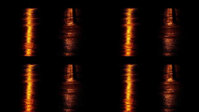 城市路灯在雨中反射在道路上