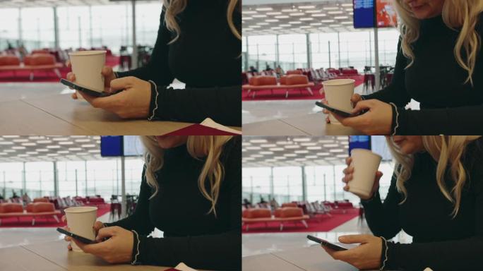 在机场休息室使用智能手机时享受咖啡的女人