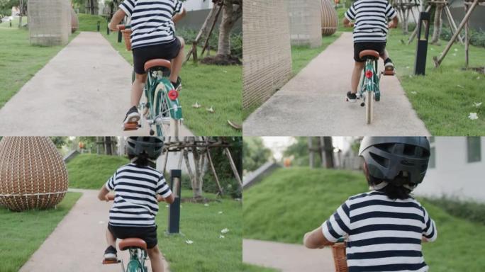 骑自行车的快乐男孩。