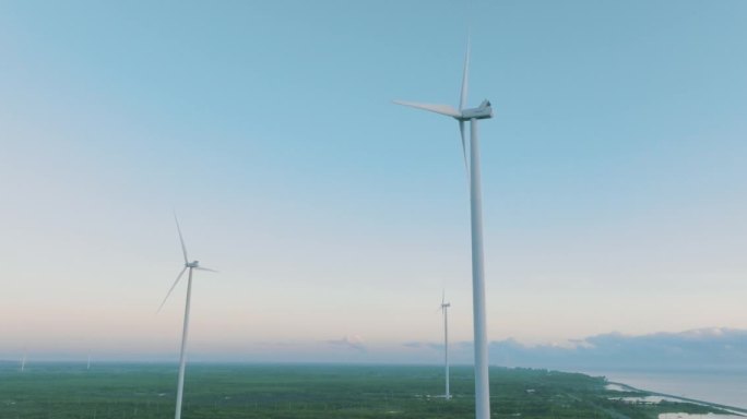 鸟瞰图日落中用于能源生产的风力涡轮机领域。