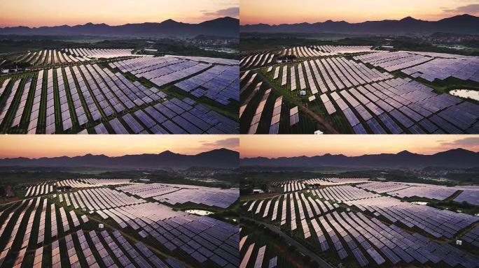日落时山顶太阳能发电厂的鸟瞰图