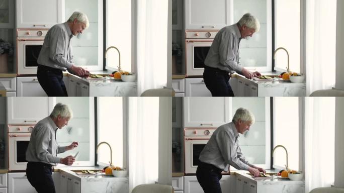 老人在现代厨房里独自做饭时跳舞