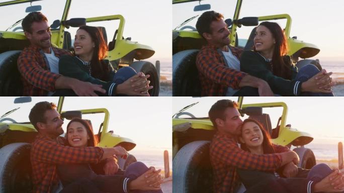 快乐的高加索夫妇坐在海边的沙滩车旁边聊天拥抱