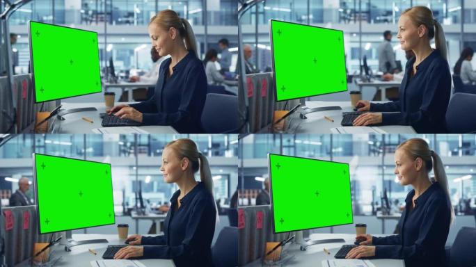 多样化的现代办公室: 自信的女商人使用带有绿屏模拟显示的台式计算机。负责电子商务客户支持、项目营销的