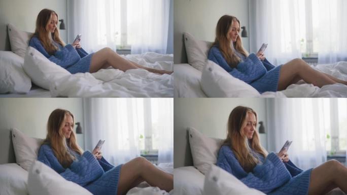 女人早上在床上检查手机