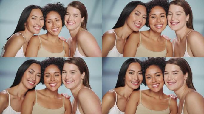 三个不同的多种族模型在孤立的背景上的美丽肖像。有趣快乐的亚洲，黑人和高加索妇女与自然，健康的皮肤。健