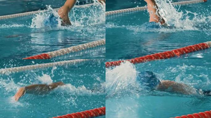 成功的男子游泳运动员在游泳池比赛。职业运动员决心使用前爬行自由泳赢得冠军。彩色电影镜头。前视图肖像慢