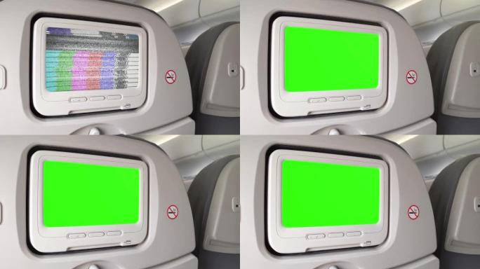 飞机座椅上的白色液晶显示屏打开色度键绿色屏幕。放大。特写。4K。