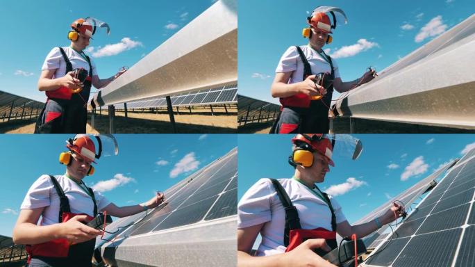 一名男性专家正在修理太阳能电池板