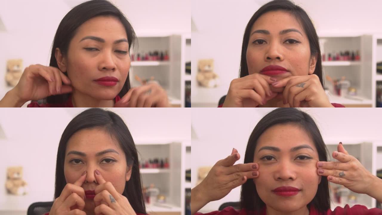 肖像: 美丽的亚洲女人用面部按摩治疗自己的头像