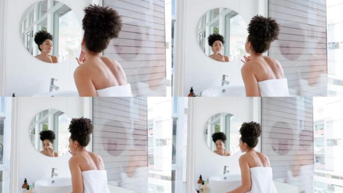 护肤，浴室美容和镜子中的女人，用于早晨护肤面部护理。健康，健康和黑人妇女在毛巾清洁面部，豪华排毒产品