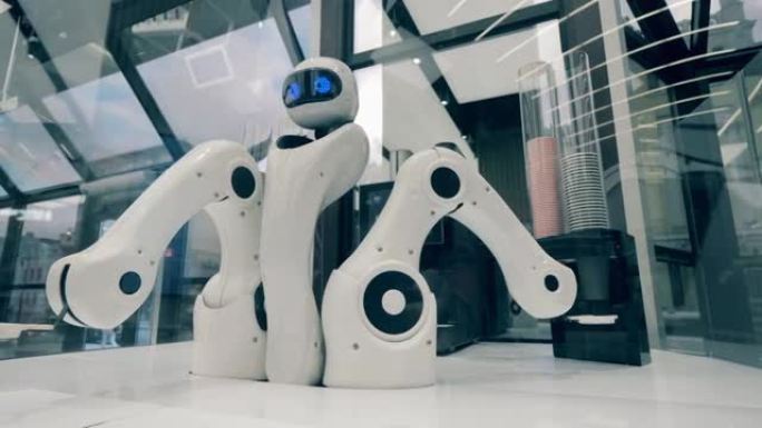 机器人的手臂正在重新放置并装满咖啡杯。未来派机器人，创新科技理念。