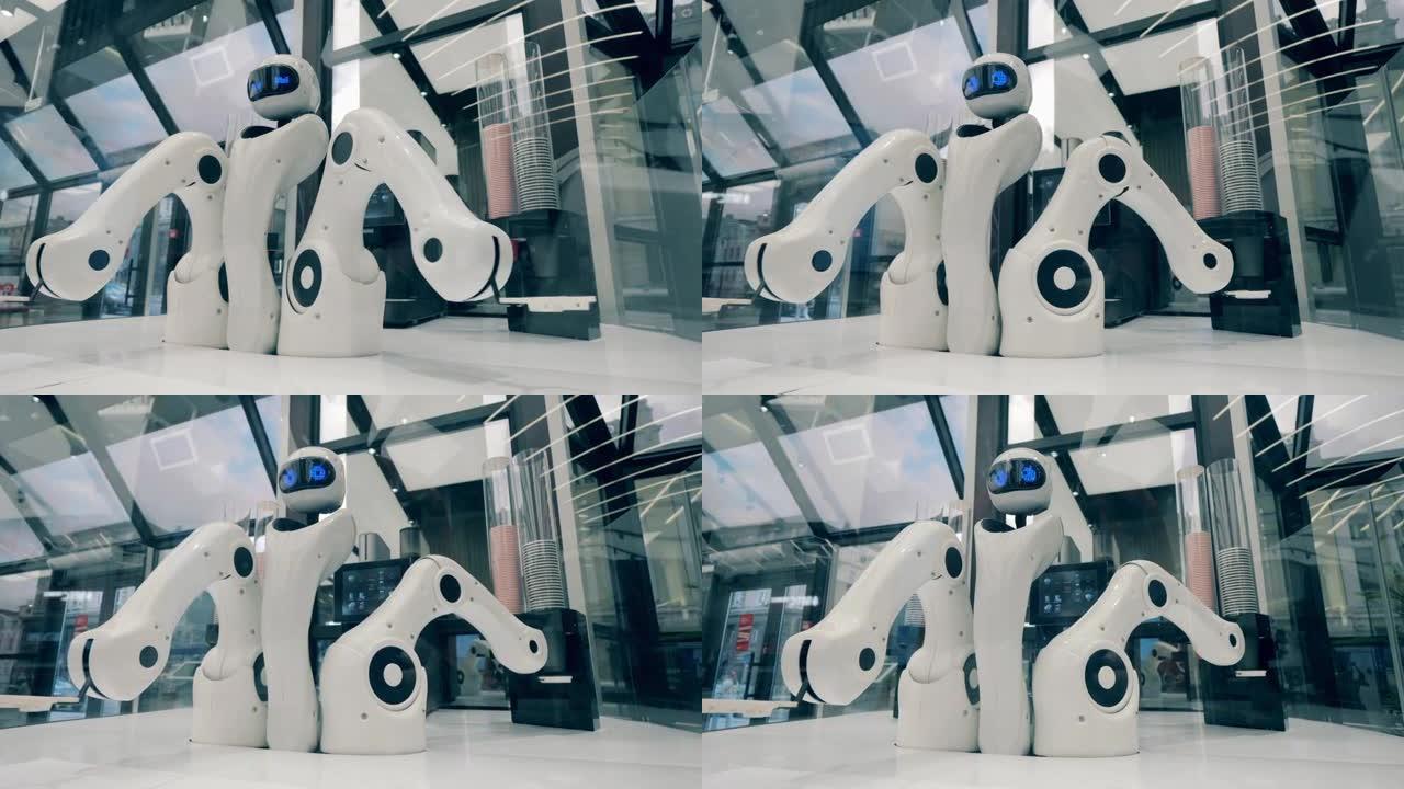 机器人的手臂正在重新放置并装满咖啡杯。未来派机器人，创新科技理念。