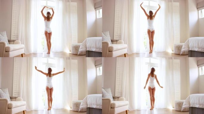 4k视频片段，一名妇女早上穿着内衣打开窗帘