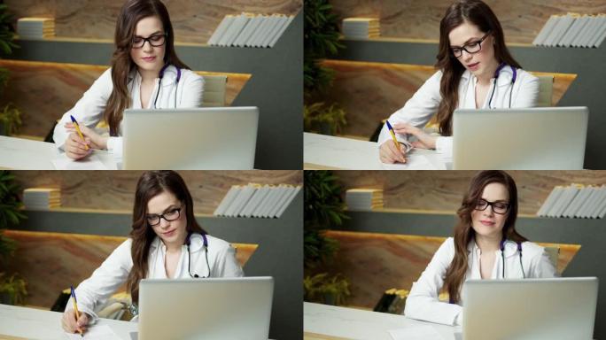 美丽的年轻女医生在视频会议上与远程患者一起工作使用虚拟聊天在线远程咨询医生专业微笑远程医疗计算机应用