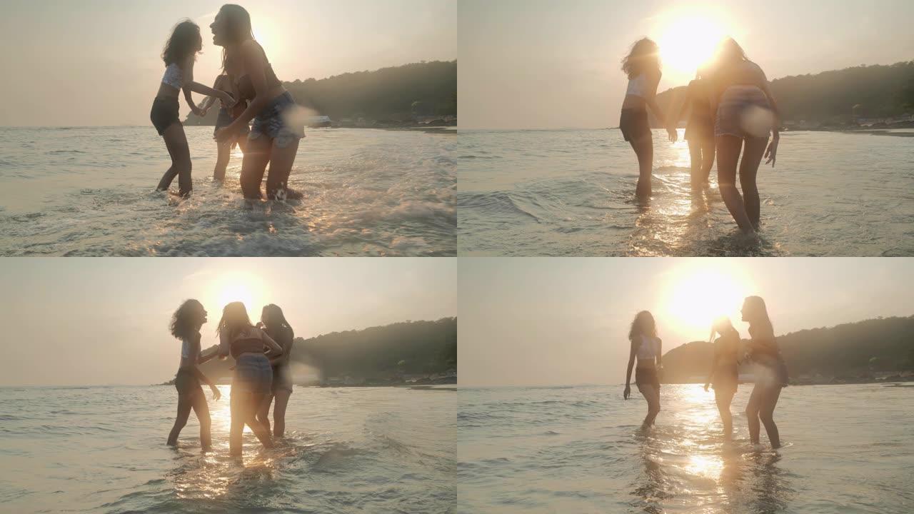 剪影三少女夏天在海滩上玩得开心。东南亚和东亚: 海滩上的乐趣