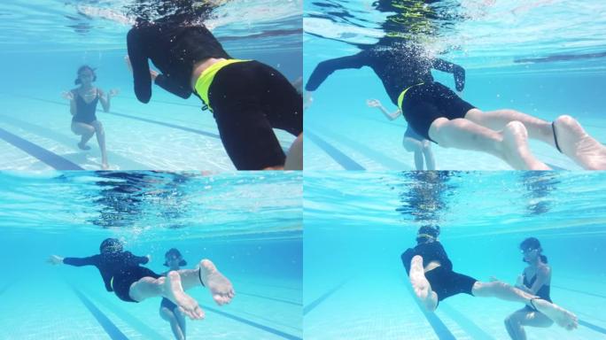 亚洲中国少年向教练游泳学习如何在水中游泳