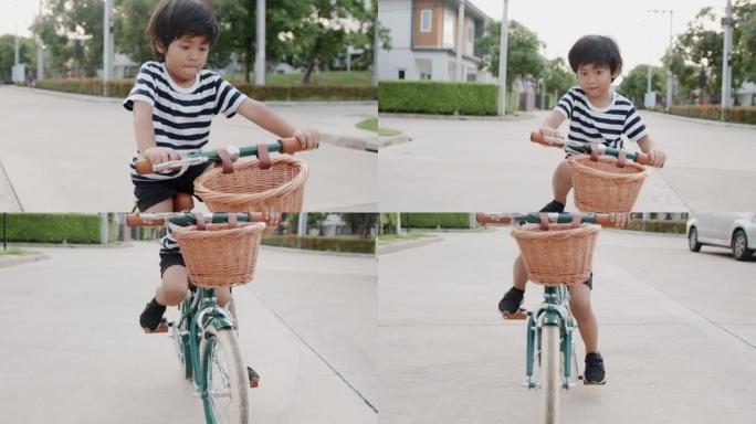 男孩骑自行车。歪歪扭扭踩脚踏车上路街上踩