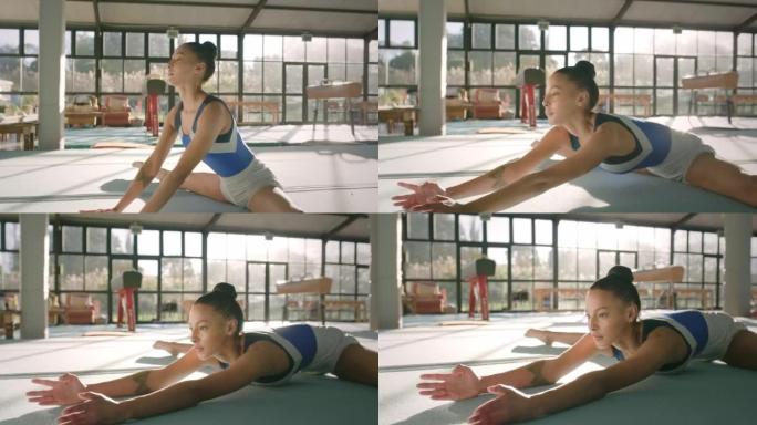 健身，运动和体操与女性锻炼并在地板上准备身体。敏捷性、平衡性和杂技演员在健身房进行灵活的训练和有氧、