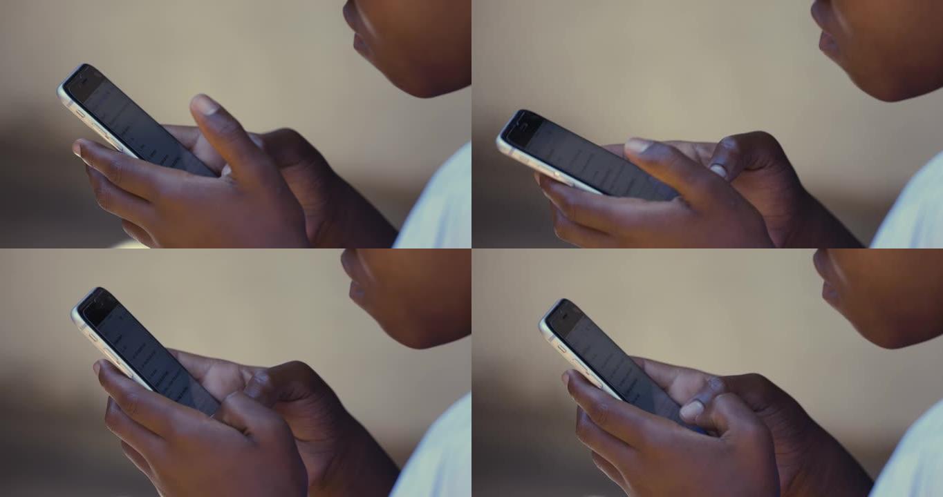贫穷。不平等。使用智能手机的年轻黑人非洲女孩的特写镜头
