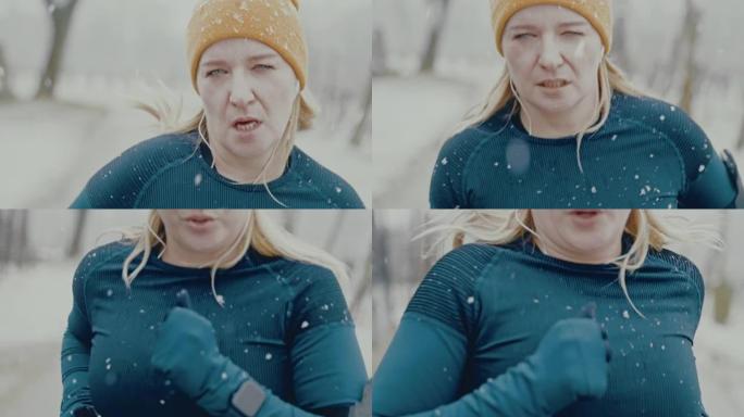 SLO MO女人在雪地里穿过森林慢跑时停下来喘口气