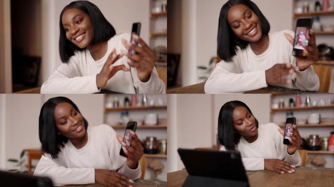 微笑的女人在手机上向视频cha上的朋友展示照片