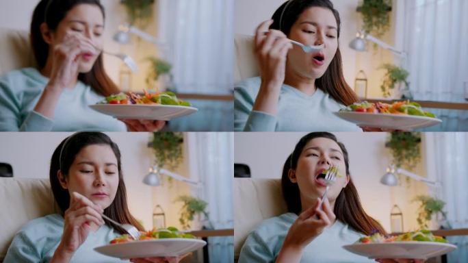 快乐健康孕妇在家吃健康绿色蔬菜沙拉