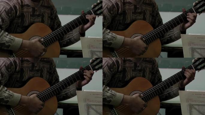 Young Man Playing a Classical Guitar in Class. Clo