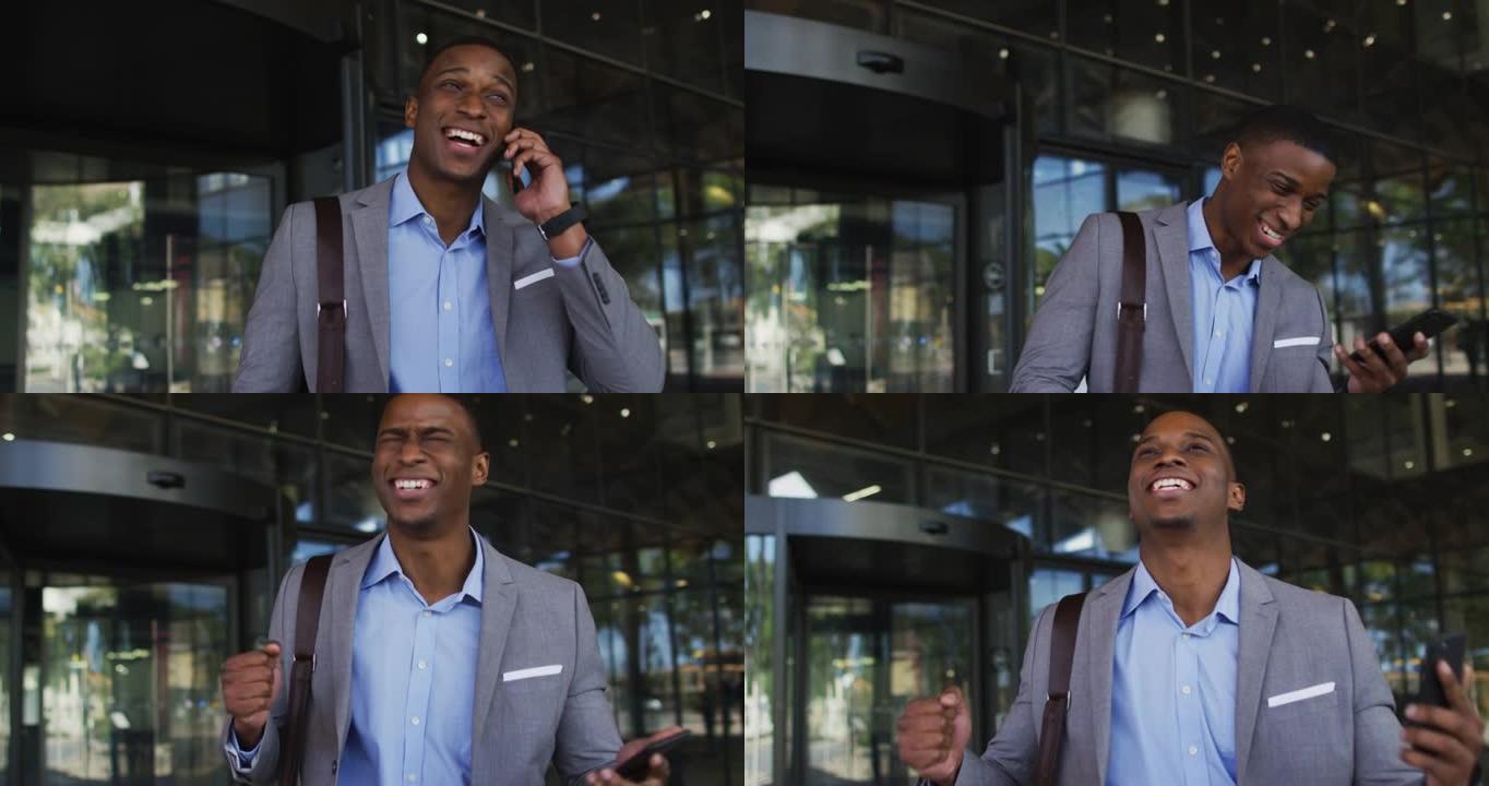 微笑的非洲裔美国商人在现代办公楼外使用智能手机