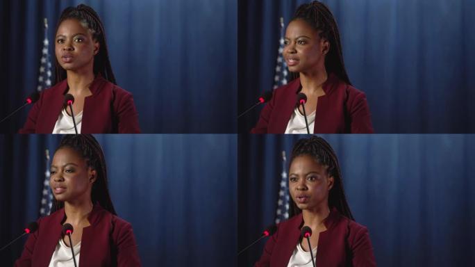 年轻的非洲裔美国政治家正在演讲，我们看到她在蓝色背景下的特写镜头