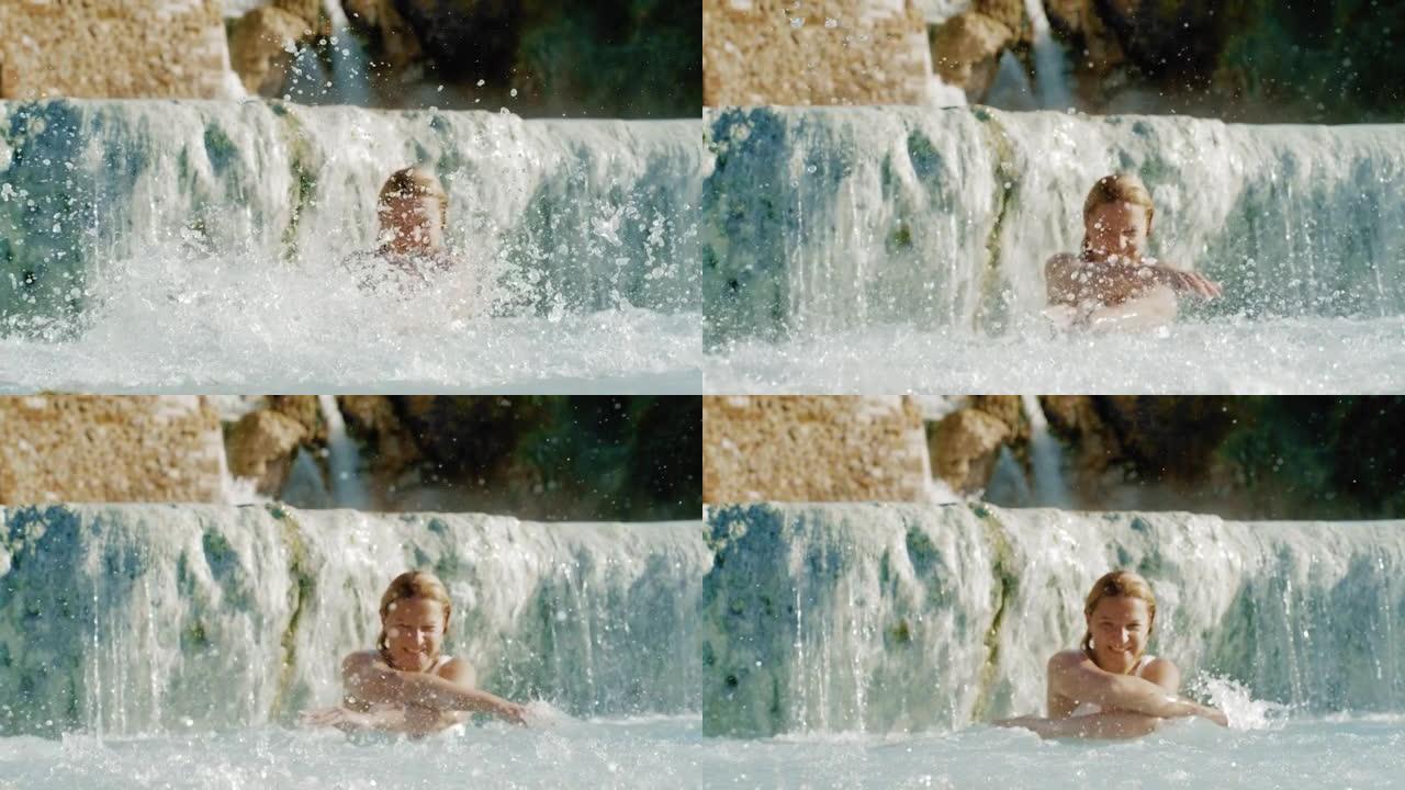 超级SLO MO肖像，一个女人在Saturnia温泉用手泼水