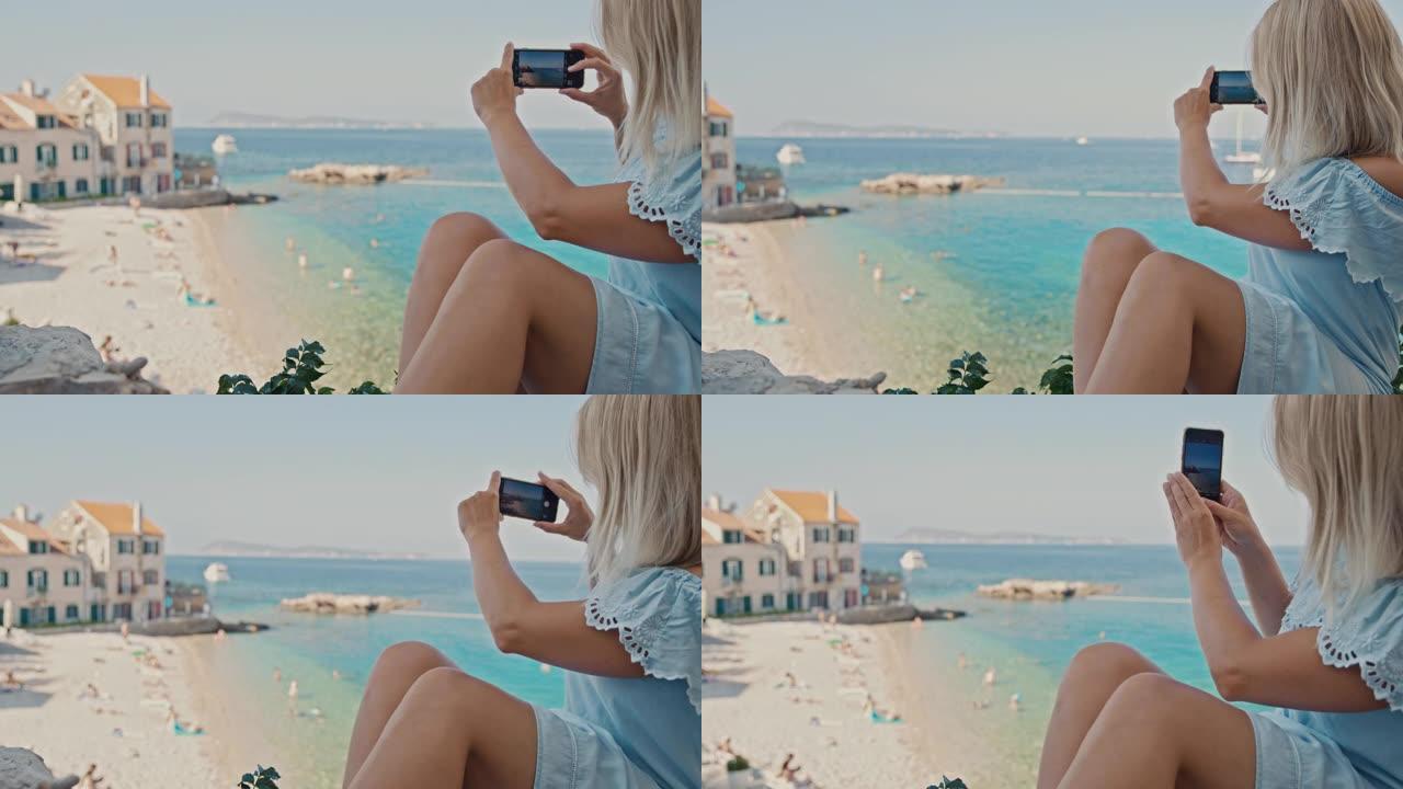 SLO MO女人用手机拍摄美丽的海滩