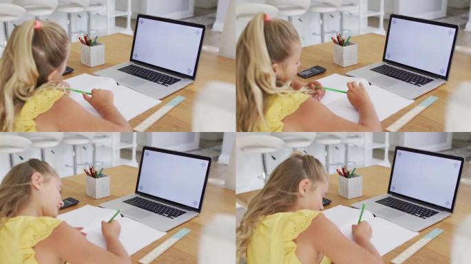 快乐的高加索女孩在家，在网上学校用笔记本电脑写字，在屏幕上复制空间
