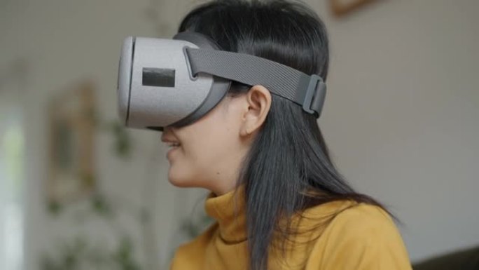元宇宙概念。戴虚拟现实耳机或虚拟现实眼镜的年轻女子