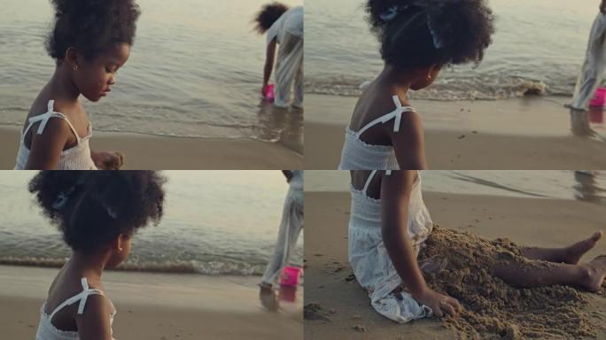 SLO MO女孩坐在沙滩上，玩和扔沙子