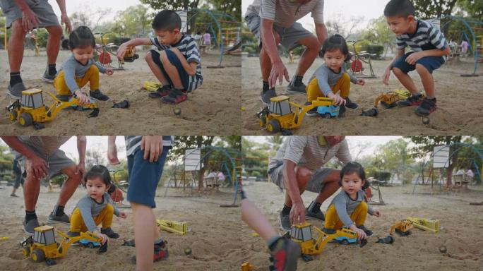 亚洲父亲与他的孙子和孙女在公园玩耍。两个兄弟姐妹喜欢在周末和父母一起玩沙盒。公园中的家庭概念