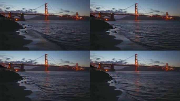 金门大桥在晚上，从海滩可以看到。美国旧金山。4k夜间拍摄