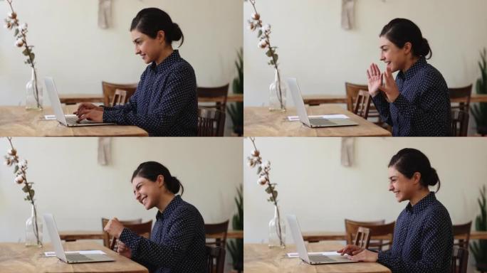 年轻的印度妇女在电子邮件中欢欣鼓舞