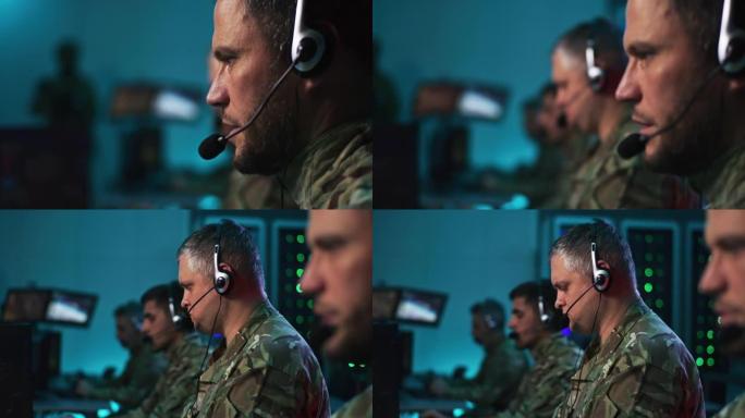 男性军事指挥官在控制中心使用电脑